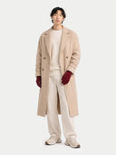Person wearing a beige coat, white shirt, and pants on a white background. #color_bordeaux
