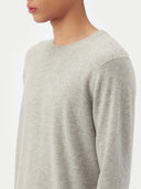 Man wearing a gray cashmere sweater on a white background. #color_steel_silver