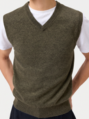 Close-up of the olive green Timeless V-Neck Cashmere Vest showing the ribbed V-neck and knit texture