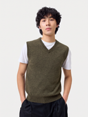 Man wearing the olive green Timeless V-Neck Cashmere Vest over a white T-shirt, front view