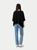 Women's Black Cashmere  Knitted Poncho worn by model, back view, on white background