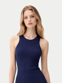 A sleeveless ribbed knit tank cashmere top in dark navy blue, shown flat against a light off-white background. #color_dark-indigo