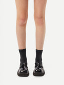 Unisex Cashmere Rib Knit Bed Socks Charcoal worn by model, detail view on white background