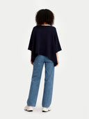 Women's Navy Cashmere  Knitted Poncho worn by model, back view, on white background