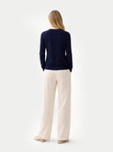 Women's Navy Cashmere Crewneck Cardigan  worn by model, back view on white background