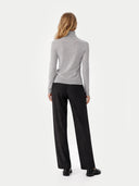 Women's Classic Cashmere Turtleneck Sweater High Rise worn by model, back view, on white background