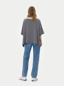 Women's Boat-Neck Cashmere Poncho Grey worn by model, back view on white background
