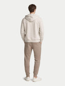 Men's Cashmere Jogger Taupe worn by model, back view on white background