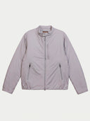 A light lavender-gray lightweight jacket with a full front zipper, stand-up collar, and two zippered hand pockets, shown flat against a light gray background.