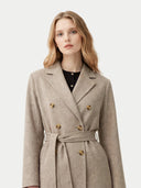 Model wearing the Women’s Double-Breasted Cashmere Coat in Taupe, front view