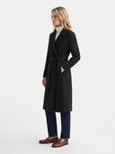Model wearing the Cashmere Wrap Coat with Belt in Black, three-quarter side view