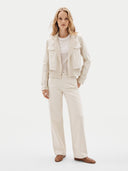 Model wearing the Natural Color Cashmere Knit and Sew Cropped Jacket in Off-White, front view