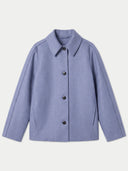 A light periwinkle blue cropped jacket with a pointed collar, long sleeves, and a front button closure, displayed against a light gray background.