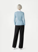 Women's Cloud Blue Cashmere Crewneck Sweate worn by model, back view on white background