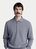 Man wearing a gray cashmere sweater over a collared shirt on a white background. #color_gray
