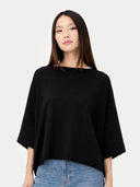 Women's Black Cashmere  Knitted Poncho worn by model, detail view, on white background