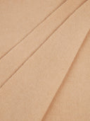 close up of a beige fabric cashmere