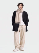 Model wearing the Natural Color Cashmere Woven Scarf in Beige, full-length front view
