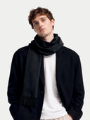 Model wearing the Cashmere Woven Scarf in Black, front view
