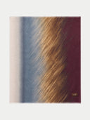 Flat lay of the cashmere printed shawl with vertical bands fading from cream through blue and gold to burgundy.