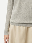 Women's Grey Cashmere Crew Neck Sweater worn by model, detail view on white background