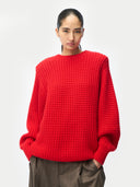 Person wearing a Wide-Shoulder Crewneck Cashmere Sweater Fiery Red on white background