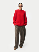 Person wearing a Wide-Shoulder Crewneck Cashmere Sweater Fiery Red on white background
