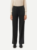 A pair of dark charcoal gray knit wide-leg pants with a drawstring waist, shown flat against a light gray background. #color_charcoal
