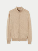 A light beige knit zip-up cashmere jacket with a mock neck, ribbed cuffs, and side pockets, displayed against a light gray background. #color_dusty-beige