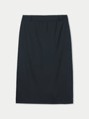 Black pencil skirt on a light gray background