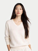 Women's White Cashmere V-Neck Sweater worn by model, detail view on white background