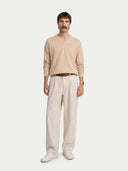 Men's Beige Cashmere V-Neck Sweater worn by model, front view on white background