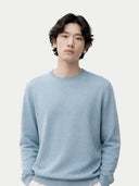 A model light blue crewneck cashmere sweater by COBI, displayed flat against a light gray background. #color_cloud-blue