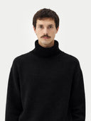 Men's Cashmere Turtleneck Black worn by model, detail view on white background