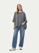 Women's Boat-Neck Cashmere Poncho Grey worn by model, front view on white background
