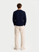 Men's Navy Crewneck Cashmere Sweater worn by model, back view on white background