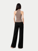 Women's  Taupe Cashmere Turtleneck Top worn by model, back view on white backround