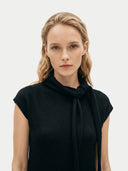 Women's Black Cashmere Tie-Neck Dress worn by model, detail view on white background