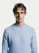 Men's Light Blue Cashmere Cable-Knit Sweater worn by model, detail view on white background