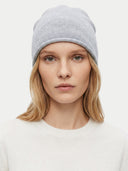 The Cashmere Cuffless Beanie in Urban Silver, shown worn.