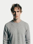 Men's Grey Crewneck Cashmere Sweater worn by model, detail view on white background