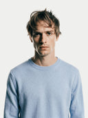Men's Light Blue Crewneck Cashmere Sweater worn by model, detail view on white background