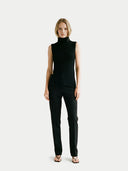 Women's Turtle Neck Cashmere Vest Black  worn by model, front view on white backround