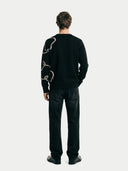 Men's  Black Cashmere Horse Jacquard Sweater worn by model, back view on white background