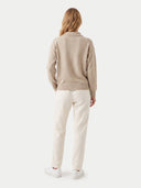 The Cashmere Polo-Collar Sweater in Natural Beige, shown worn.