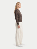 The Cashmere Polo-Collar Sweater in Brown, shown worn.