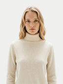 Timeless Cashmere Turtleneck Sweater Off white worn by model, detail view, on white background