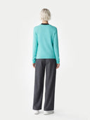 Women's Holiday Blue Cashmere Crewneck Sweater worn by model, back view on white background 