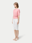 Women's Short Dolman Sleeve Cashmere Sweater Pink Icing  worn by model, side view on white background