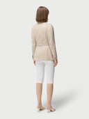 Woman wearing a beige jacket with multiple pockets on a white background #color_dusty-beige